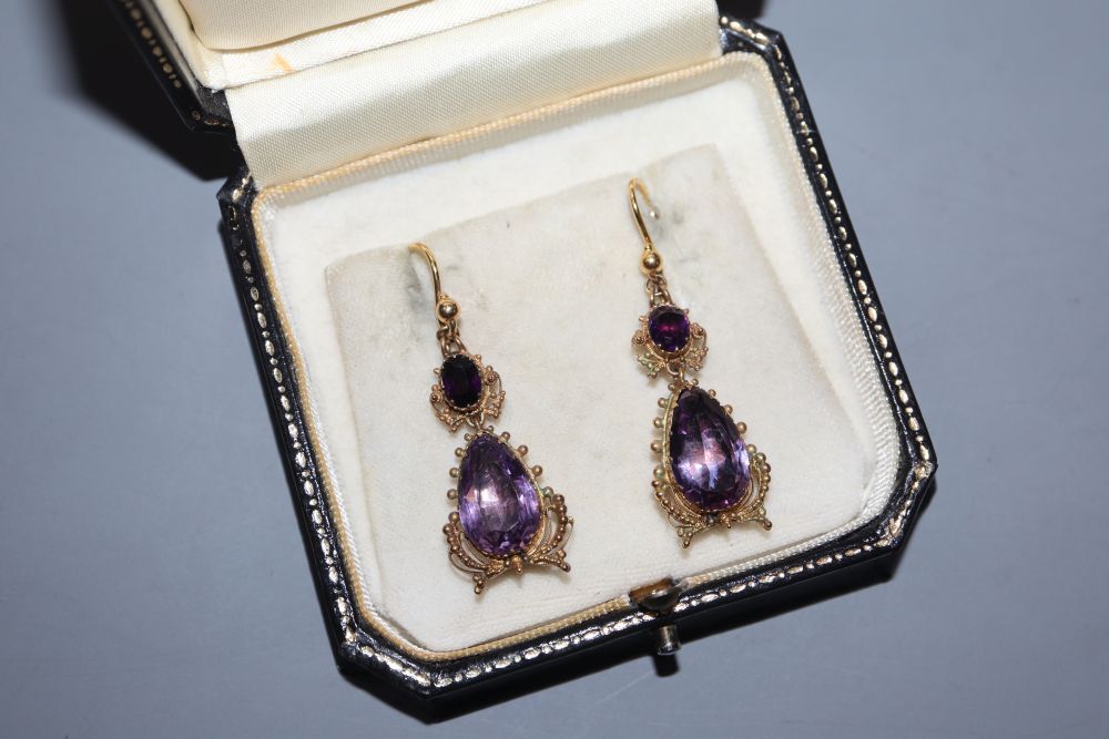 A pair of Victorian yellow metal and two stone amethyst set drop earrings, 38mm ex. ear wire, gross 7.8 grams.